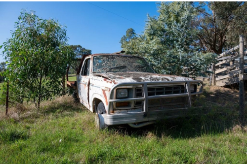 Rusty abandoned truck in a field